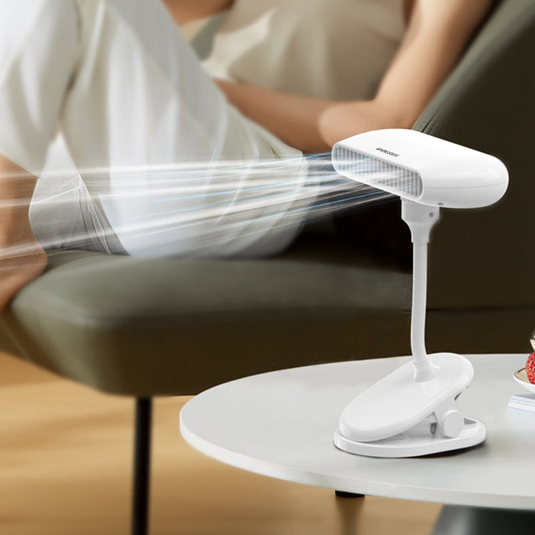 Magnussen FN3 clip-on Airflow fan cooling someone relaxing on a sofa